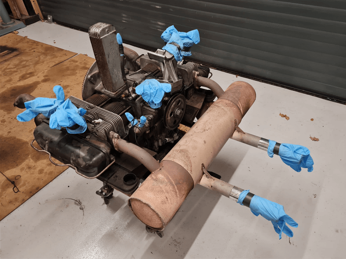 Sticking rubber gloves to strategic points on your engine is an integral - and amusing - part of the process!