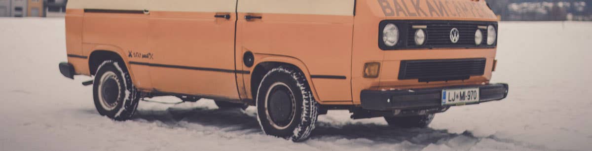 A VW T25 parked up in the snow. Image credit: Balkan Campers, via Unsplash
