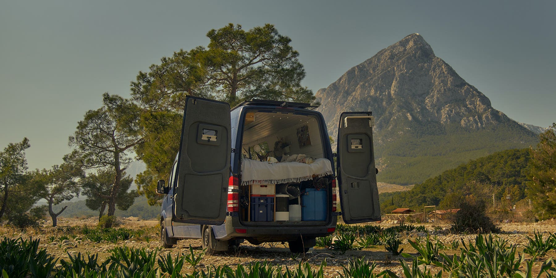 A large campervan, with the double rear doors open
