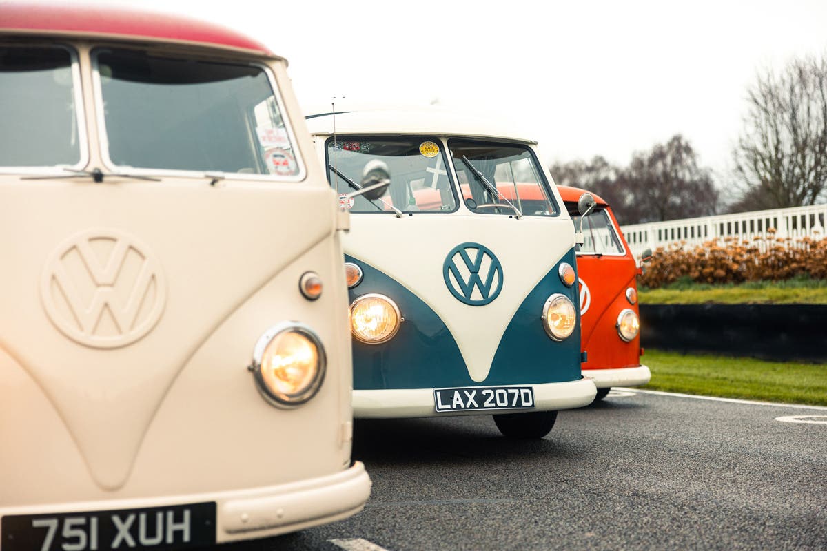 Three different Volkswagen T2 Split Screens on the track at Goodwood