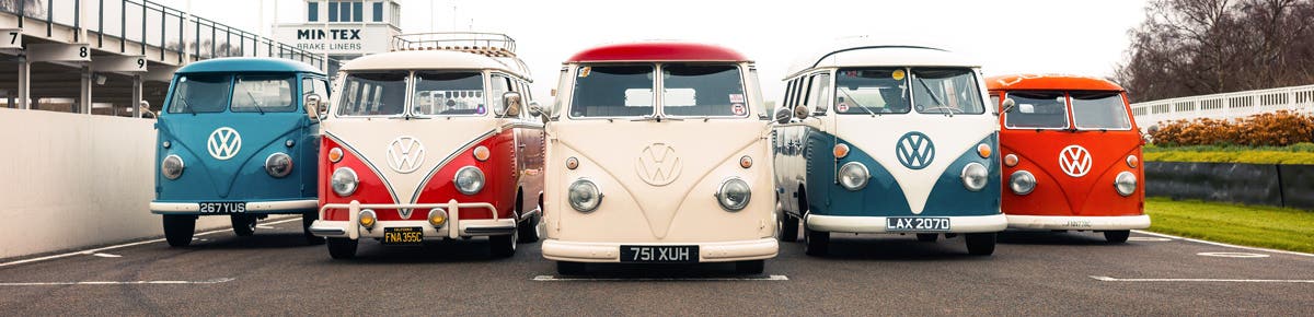 A lineup of VW T2 Splits on the track at Goodwood