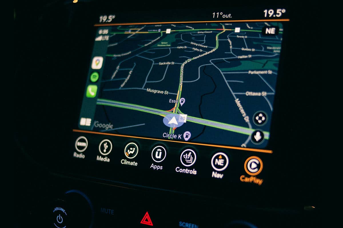 A vehicle head unit showing maps, and Apple Car Play