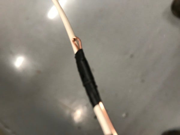 Pulling cables through the heat shrink tubing